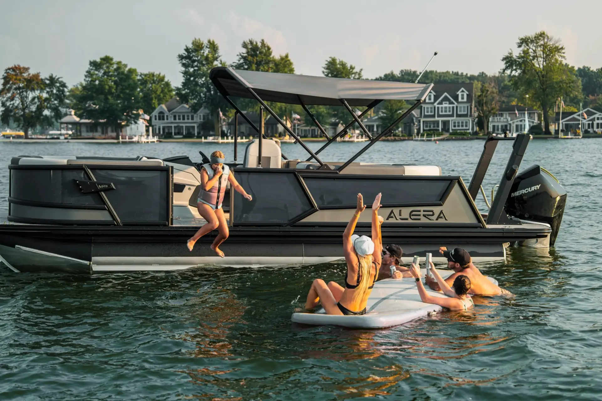 Family swimming and lounging off an Alera pontoon