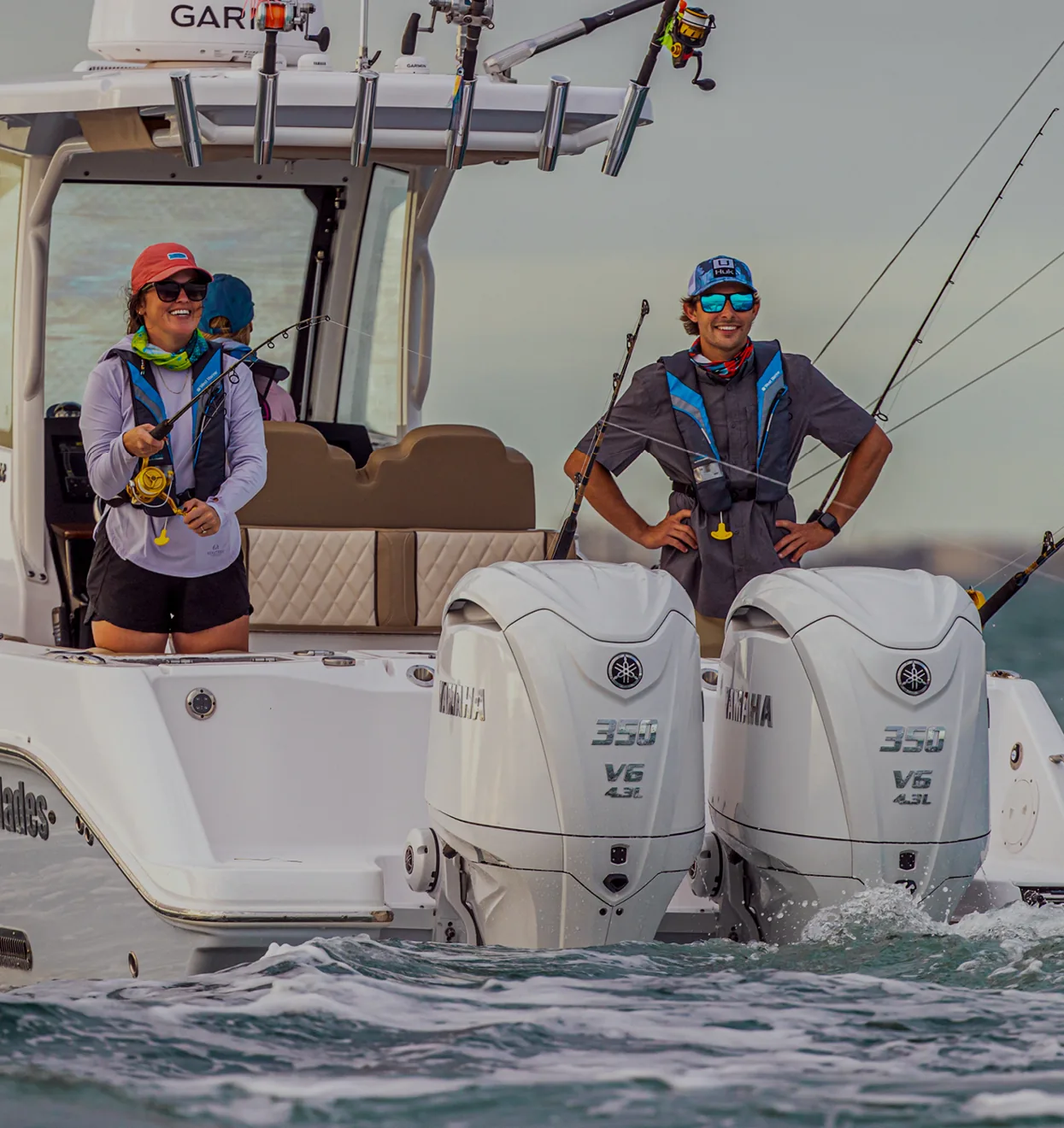 Anglers on a center console with twin Yamaha outboards
