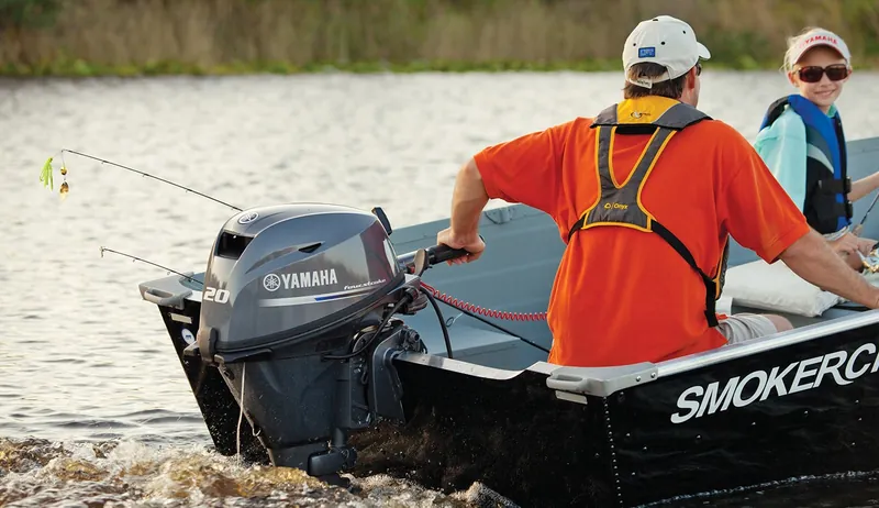 Angler running an aluminum jon boat with a small Yamaha tiller outboard